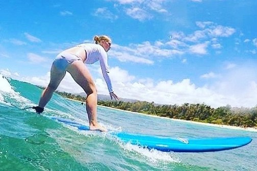 a man riding a wave on a surfboard in the water